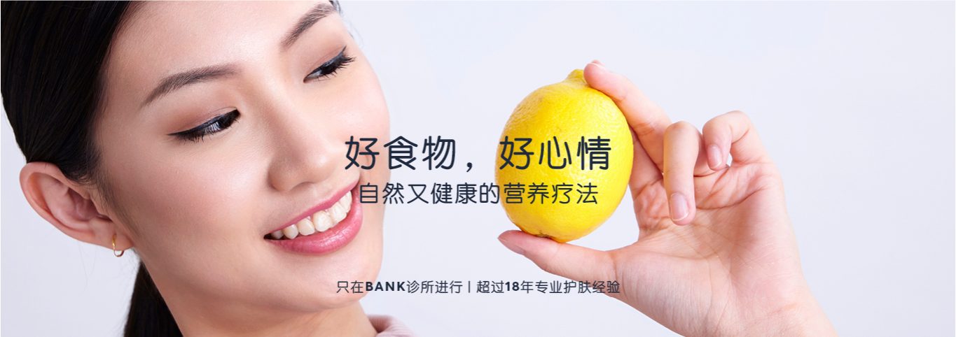 Asian lady holding a lemon
