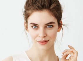 Headshot of lady with mild rosacea with plain white background