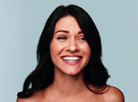 A woman smiling after receiving HIFU Skin Tightening treatment